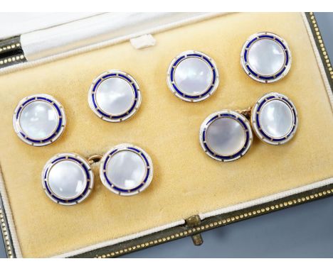 A cased 9ct, mother of pearl and enamel set six piece dress stud set, gross set 10.3 grams