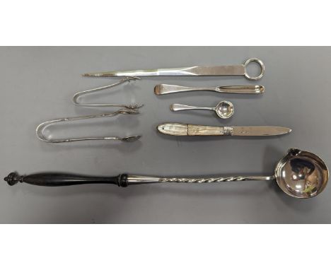 A George VI silver paper knife, London, 1937, a plated toddy ladle, two pairs of silver sugar tongs, damaged silver fruit kni