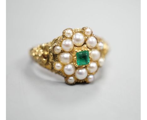 A Victorian style yellow metal, emerald and split pearl cluster set dress ring, size M, gross weight 3.6 grams.