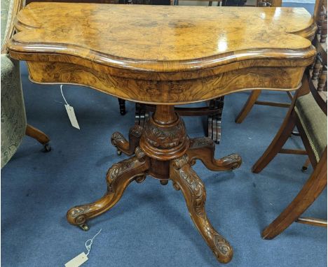 A Victorian figured walnut serpentine folding card table, width 92cm, depth 45cm, height 73cm