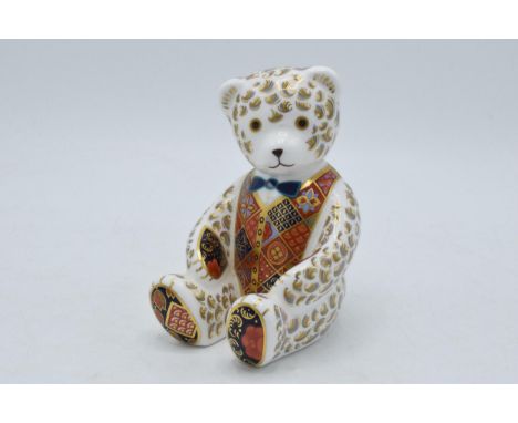 Royal Crown Derby paperweight, Teddy Bear, 12cm, with blue bow tie and silver stopper.  In good condition with no obvious dam