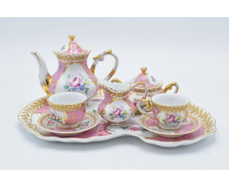 Regal Porcelain miniature tea for two set with pink floral decoration to consist of a teapot, milk, sugar, 2 duos and a tray 