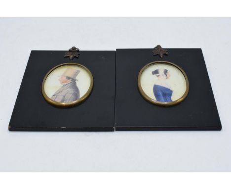 A pair of early 20th century framed miniature portrait in ebonised frames, 15cm tall inc frame (2).