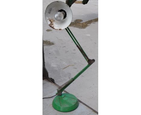 A vintage 20th century green anglepoise lamp with round base, approx 95cm tall at tallest. Untested.  