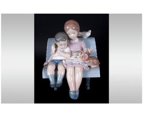 Lladro Figure 'Surrounded By Love' model number 6446, issued 1997. 7'' in height. Mint condition.