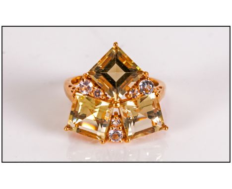 Green Gold Quartz and White Topaz Ring, in trillion style, comprising three square cut natural green gold quartz stones separ