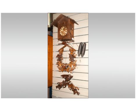 Black - Forest Carved Wood Cuckoo Clock Carved To The Front with Birds and The Chicks In a Nest Surmounted by a Large Carved 