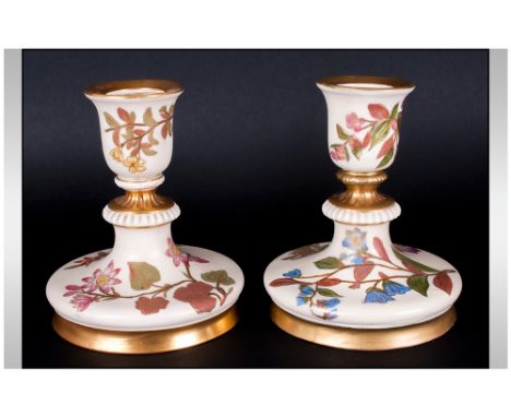 Royal Worcester Blush Ivory Pair Of Candlesticks, Floral decoration with gold leaf border. Circa 1890, 4'' in height.