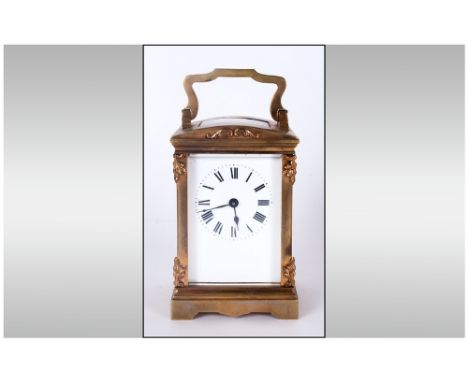 English Brass Carriage Clock With Visible Escapement. Glass panels to sides & back. White porcelain dial. Black numerals S.F 