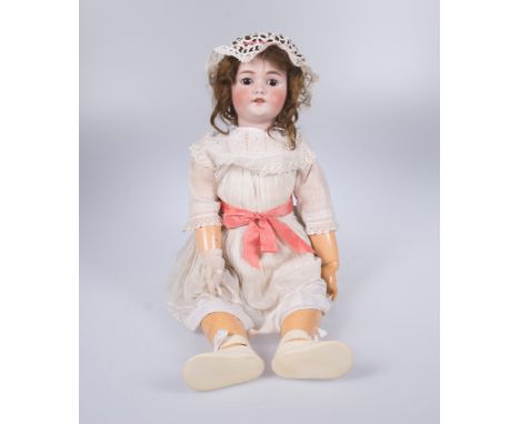 Doll. Simon Halbig. Germany. Circa 1910. ”Dolly face” doll, size 13, mould 1078, with a porcelain head, sleep eyes and an ope