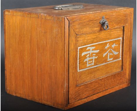 An early 20th Century Chinese Oriental Mahjong set. Hardwood case with swing handle and series of drawers. Fitted with variou