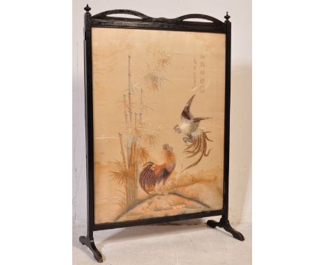 An early 20th Century Chinese hand embroidered silk screen. The silk panel depicting cockerel and hen with calligraphy in nat