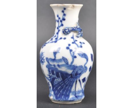 A 19th Century Chinese Kangxi mark blue and white porcelain vase. The vase of baluster shape with hand painted landscape scen