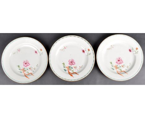 A set of three 18th Century Chinese porcelain plates of circular form having hand painted polychrome enamel floral sprays wit