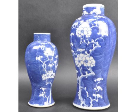 A graduating pair of 19th Century Chinese Kangxi revival porcelain prunus pattern blue and white vases of meiping shape. Both