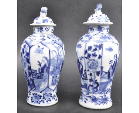 A pair of 19th Century Chinese Kangxi mark blue and white porcelain vases decorated in the Long Elisa pattern. The vases with