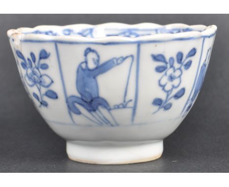 An early 18th Century Chinese Kangxi period blue and white porcelain tea bowl. Hand painted decoration depicting scenes of fi