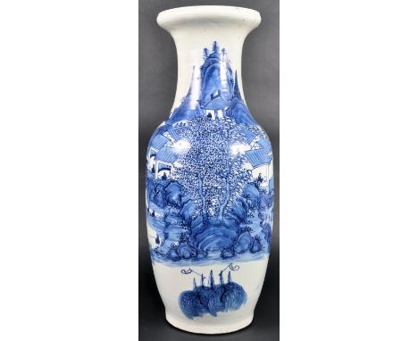 A large 19th Century Chinese Qing Dynasty blue and white ceramic floor standing vase / stick umbrella stand. Flared rim with 