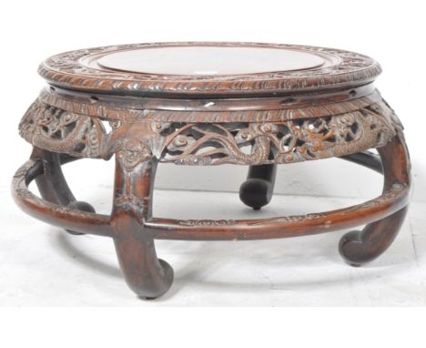 An early 20th Century Chinese carved hardwood Huanghuali low carved coffee table / side occasional low table of circular form