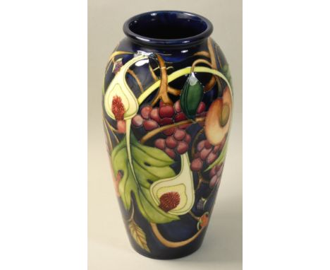 A Moorcroft 'Queens Choice' pattern tube line decorated vase, designed by Rachel Bishop, impressed factory marks and leaf, sh