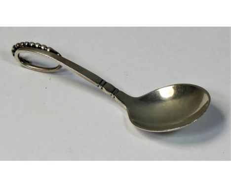 Georg Jensen, a Danish silver caddy or preserve spoon, Copenhagen, 1933-1944, pattern number 41, with beaded scroll handle, 1