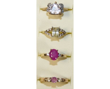 A 9ct gold ruby set ring, size N 1/2, two 9ct gold gem set rings, combined weight 7.4 gms and a silver gilt ring (4).