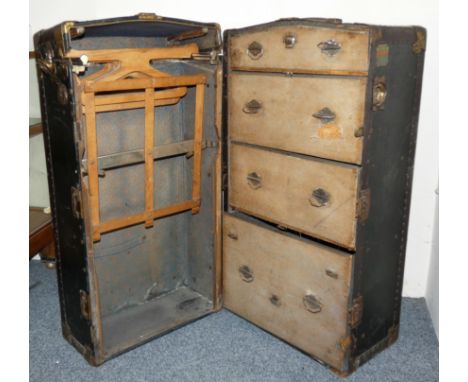 An American Belber wardrobe steamer trunk, c. 1925, with safe lock mechanism, opening to reveal a set of graduated drawers to