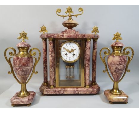 Lardot and Boyon, Paris, a 19th century French gilt metal and pink variegated marble clock garniture, the white enamel dial w