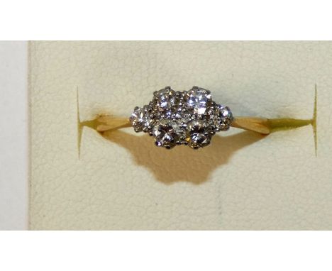 An 18ct gold seven stone diamond ring, panel set with brilliant cut stones, total weight approximately 0.5 cts, size K 1/2.