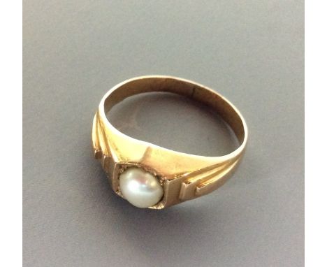 ART DECO, AN IRANIAN GOLD AND PEARL SIGNET RING Having a single pearl held in plain gold mount with geometric stepped design 