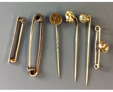 A COLLECTION OF LATE 19TH/EARLY 20TH CENTURY 9CT GOLD AND PEARL SET STICKPINS  To include a single pearl set in an engraved c
