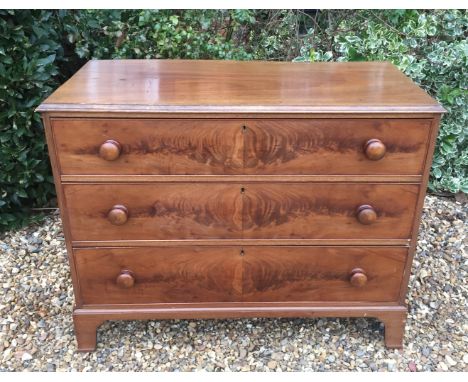 A VICTORIAN FLAME MAHOGANY CHEST OF DRAWERS  The three graduated drawers raised on shaped bracket feet  Measurements: W 111cm