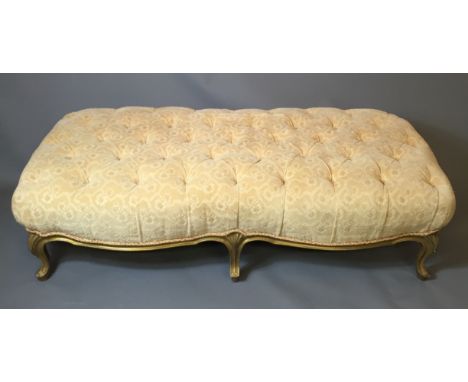 A LARGE LATE 19TH CENTURY FRENCH STOOL  In cut moquette button back upholstery and raised on six gilt cabriole legs, with she