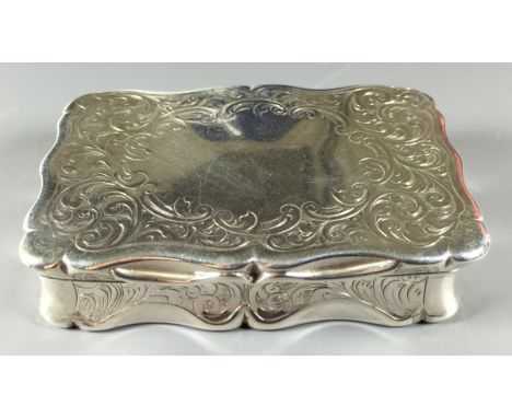 A LARGE VICTORIAN SILVER RECTANGULAR SNUFF BOX With chased scroll work decoration and a silver gilt interior, hallmarks 'Lond