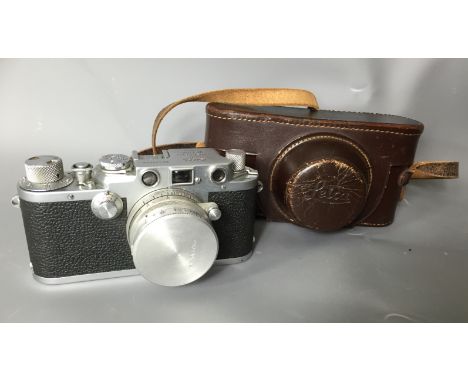 LEICA, A 1950'S ERNST LEITZ WETZLAR D.R.P CAMERA Model no. 525744, complete with original lens and fitted leather case.