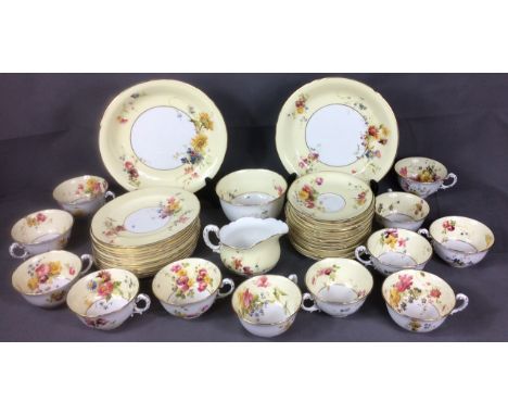 AN EARLY 20TH CENTURY ROYAL WORCESTER PORCELAIN TEA SERVICE  Having a wide cream border, hand painted with floral sprays and 