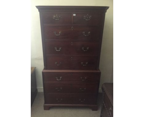 A GEORGE III PERIOD MAHOGANY CHEST ON CHEST the cornice above an arrangement of two short above three long drawers, on bracke