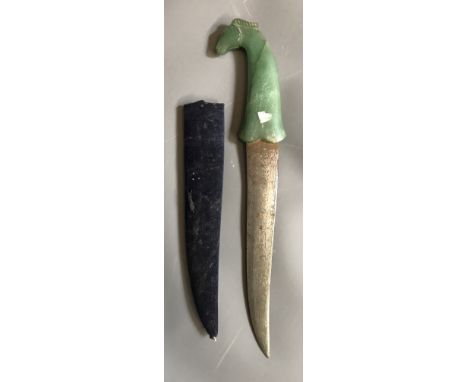 A LATE 19TH/EARLY 20TH CENTURY MONGOLIAN JADE DAGGER The jade handle carved with a horses head on a finely engraved steel bla