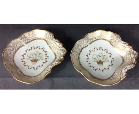CHAMBERLAINS WORCESTER A pair of late 18th/19th century porcelain sweetmeat dishes, having a wide stylised gilt border and th