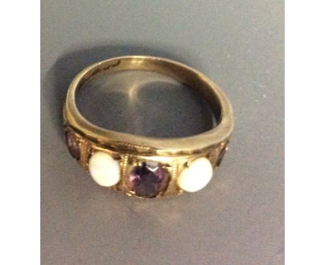 A VINTAGE 9CT GOLD, OPAL AND AMETHYST RING Having three oval cut amethysts interspersed with two cabochon cut opals.