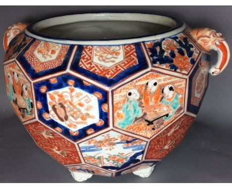 A 19TH CENTURY JAPANESE IMARI POTTERY JARDINIERE circular shape with unusual hand painted cartouches depicting interior scene