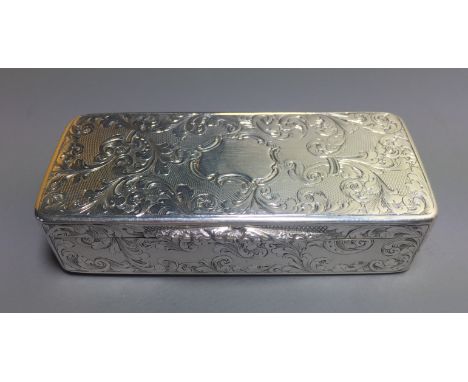 A VICTORIAN SILVER SNUFF BOX With engine turned and engraved foliate scroll decoration throughout, the silver gilt interior h