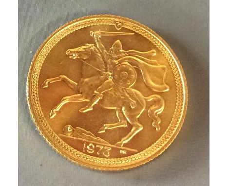 A QUEEN ELIZABETH 22CT GOLD SOVEREIGN, 1973 Isle of Man issue?, having a Norse warrior on horseback and a portrait of Queen E