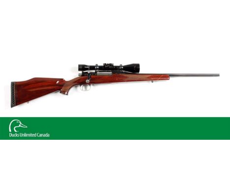 This is a nice example of an early four-digit 1950's custom Weatherby rifle with the early South Gate stamped FN action in a 