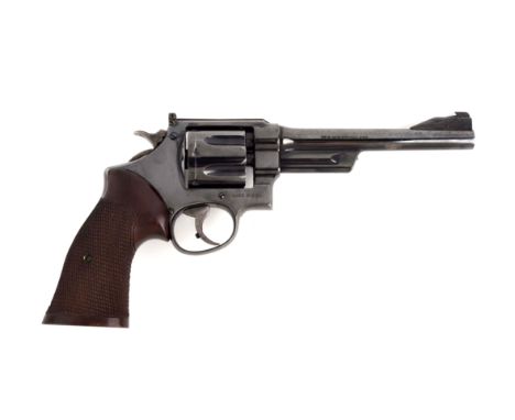 This revolver was manufactured 1931 to 1941 and was sent to King for custom work.  Including King stamped ramp reflector base