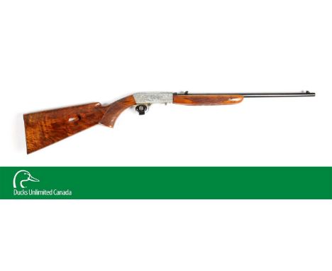The frame of this takedown rifle is in a French satin nickel with intricate deep engraving with scrolls; right panel shows se