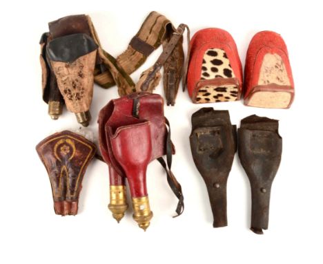 Comprised of:  1) Pair of red morroco leather saddle holsters with gilt-brass tips, with a pair of separate "caps" or covers,