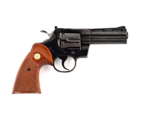 Manufactured 1977.  Standard features include full vent rib, adjustable sight, no outline, full royal blue finish, and Colt g
