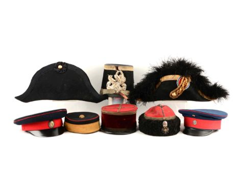 Includes a 20th century theatrical or reproduction chapeau bras of wool felt with circular ribbon cockade and gold button and