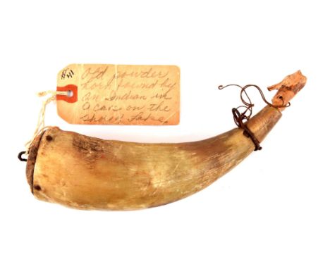Plain horn body with label attached to wooden plug, stating it was found by an Indian in a cave near Lake Champlain.  Folk ar